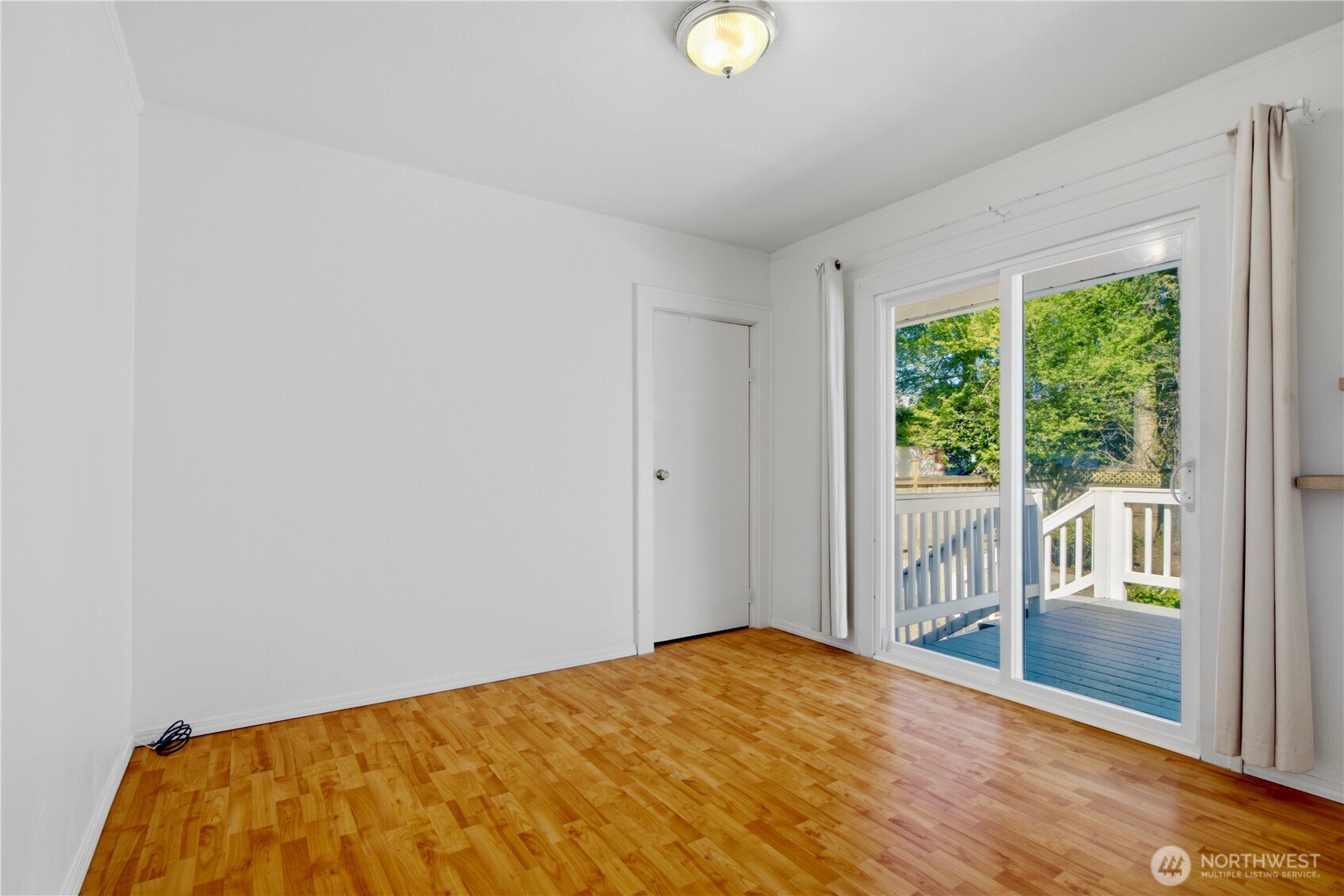 116 Northeast 133rd Street Seattle, WA 98125 - Photo 13 of 23 a view of empty room with wooden floor