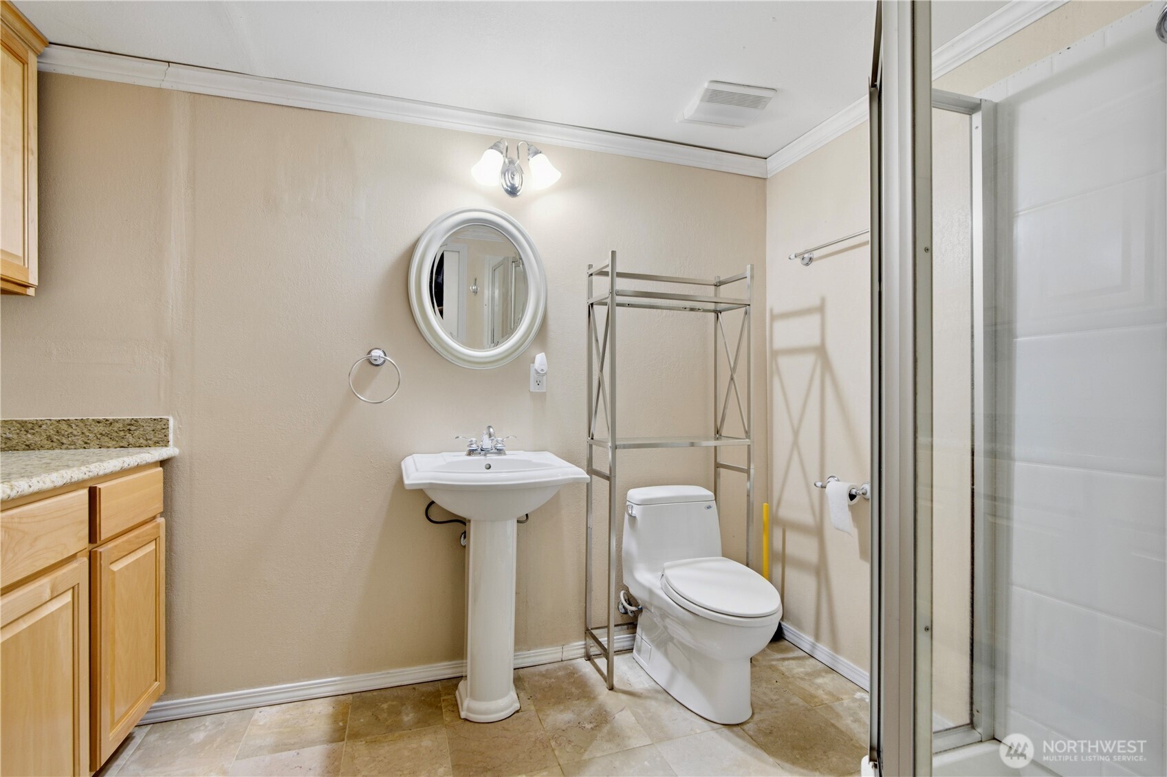 116 Northeast 133rd Street Seattle, WA 98125 - Photo 15 of 23 a bathroom with a toilet a sink and a mirror
