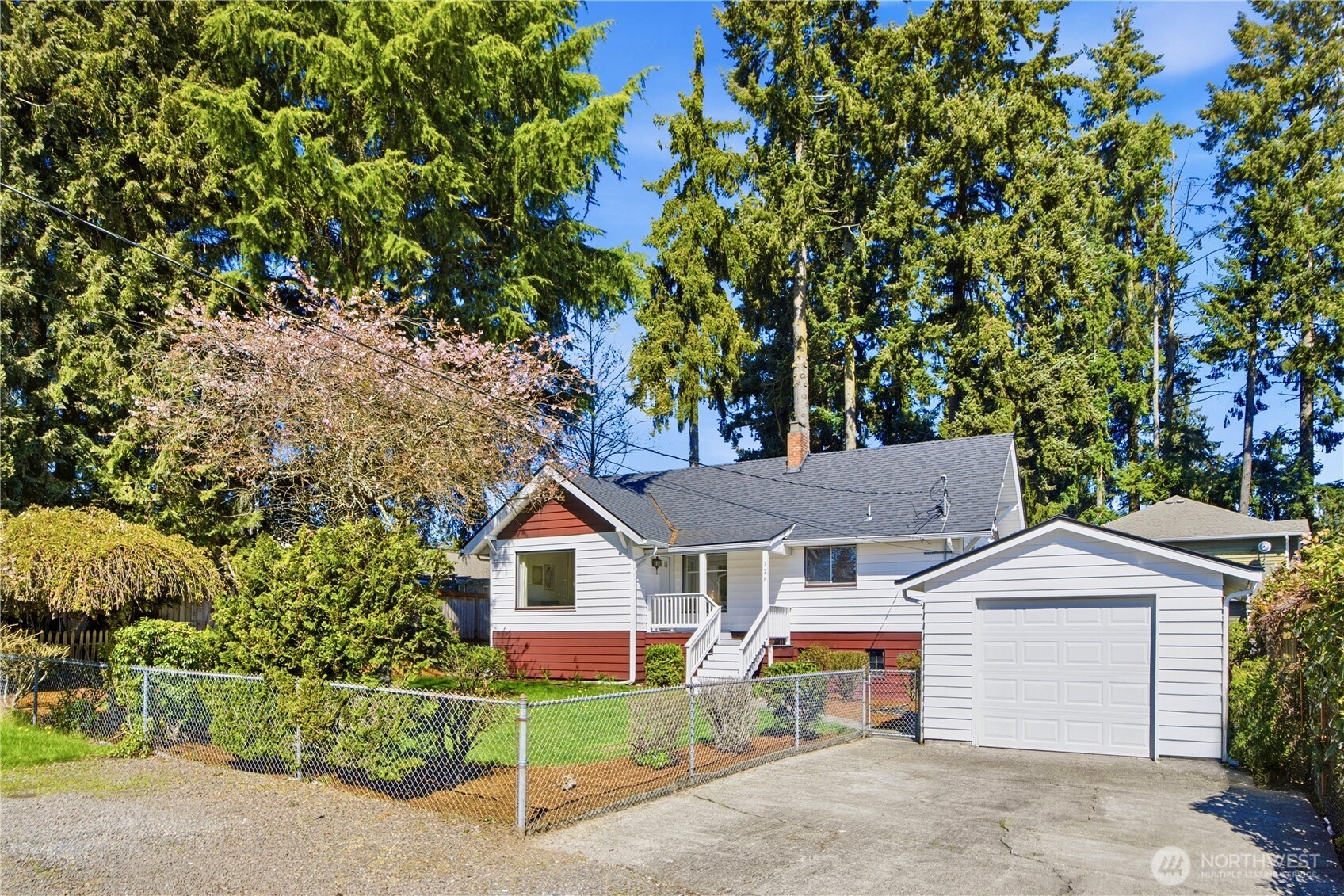 116 Northeast 133rd Street Seattle, WA 98125 - Photo 23 of 23 a front view of a house with a yard and garage