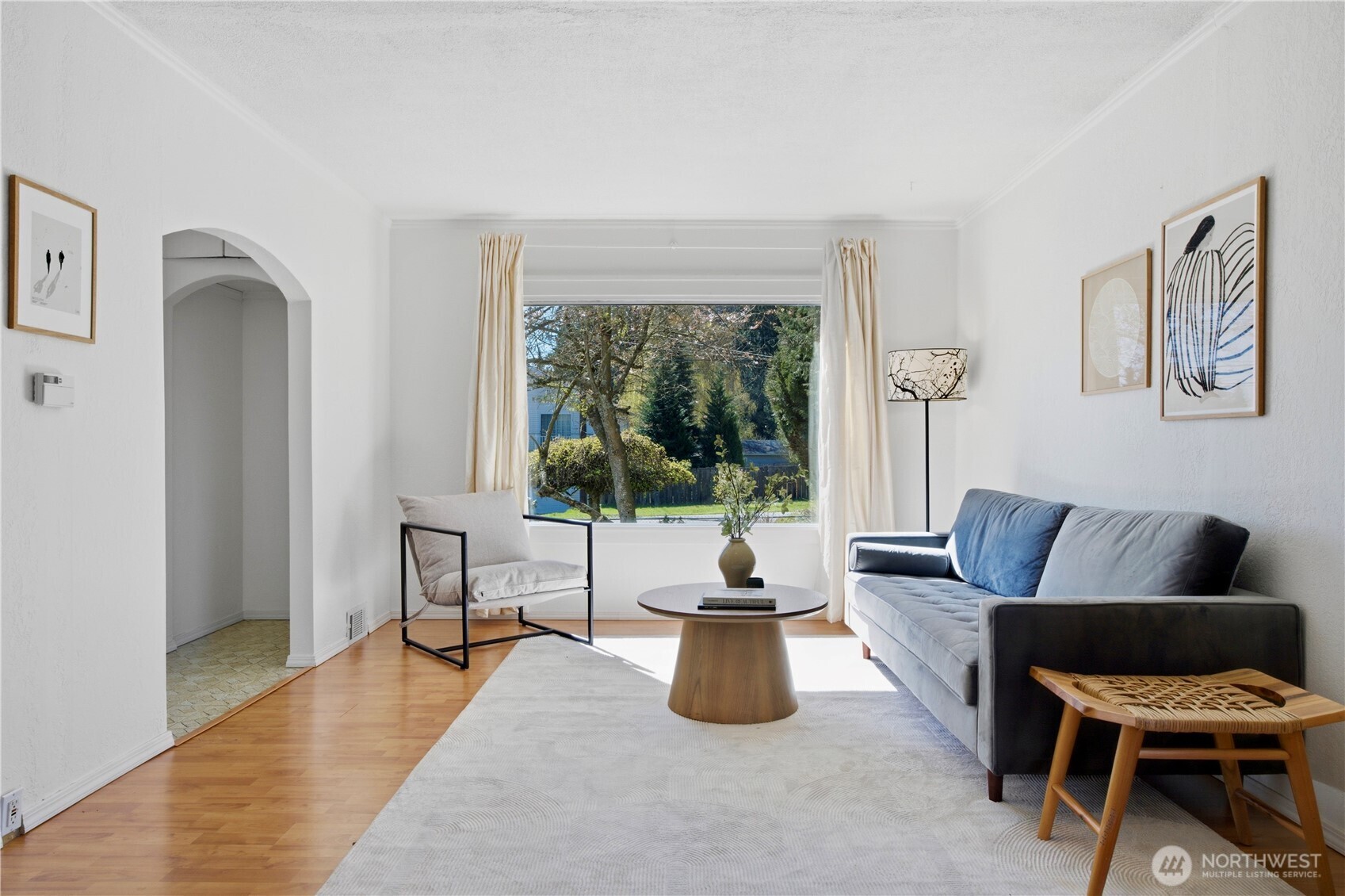 116 Northeast 133rd Street Seattle, WA 98125 - Photo 5 of 23 a living room with furniture and a large window