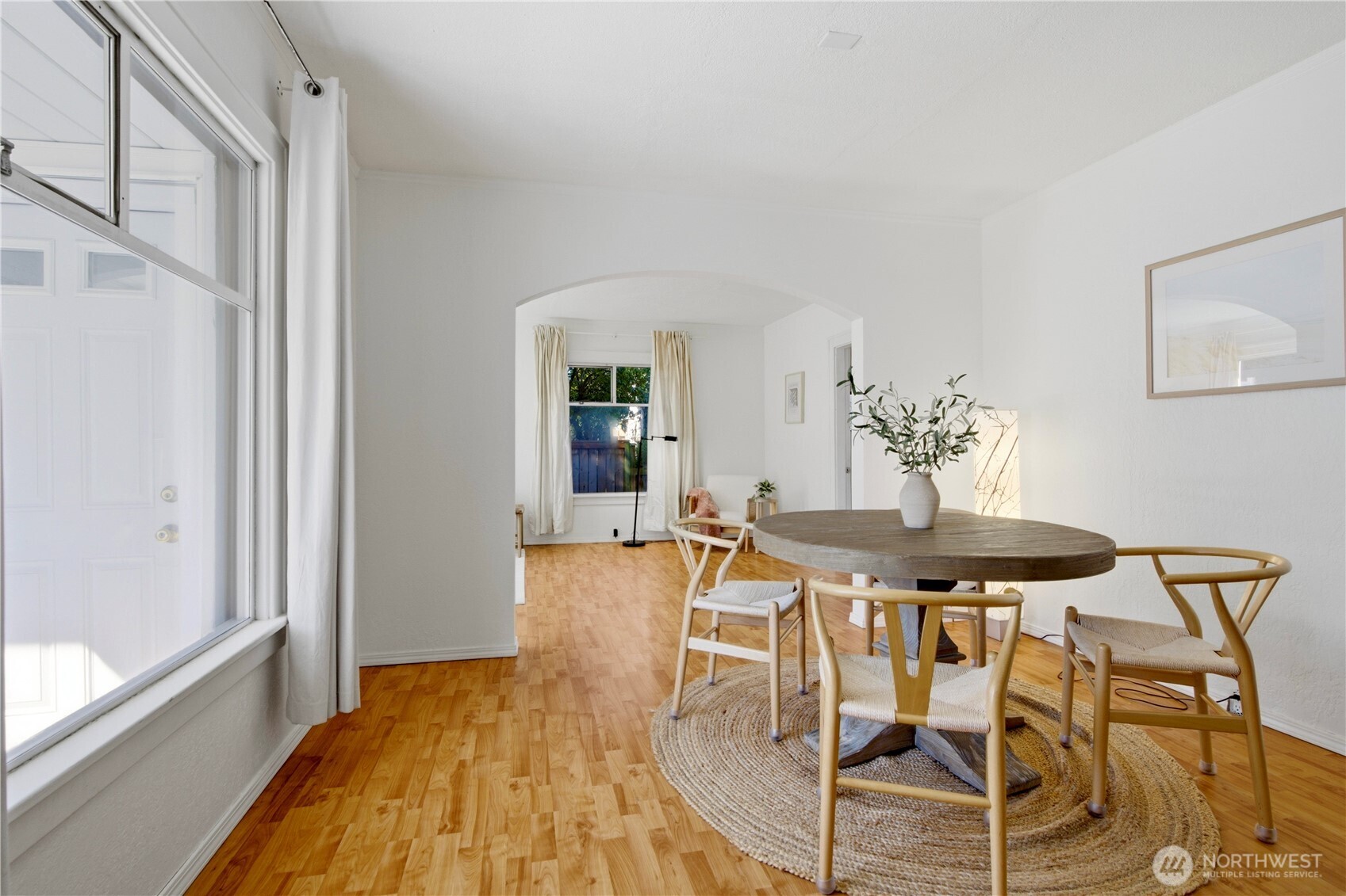 116 Northeast 133rd Street Seattle, WA 98125 - Photo 7 of 23 a view of a dining room with furniture and wooden floor