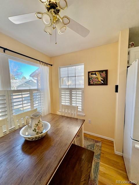 4 Shetland Court Highlands Ranch, CO 80130 - Photo 20 of 46 a view of a dining room with furniture window and wooden floor