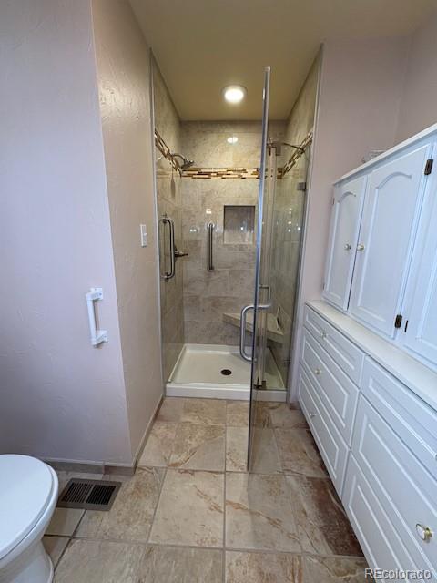 4 Shetland Court Highlands Ranch, CO 80130 - Photo 26 of 46 a bathroom with a shower and a toilet