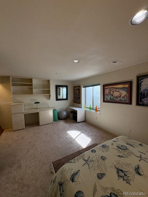 4 Shetland Court Highlands Ranch, CO 80130 - Photo 33 of 46 a bedroom with a bed and a view of kitchen