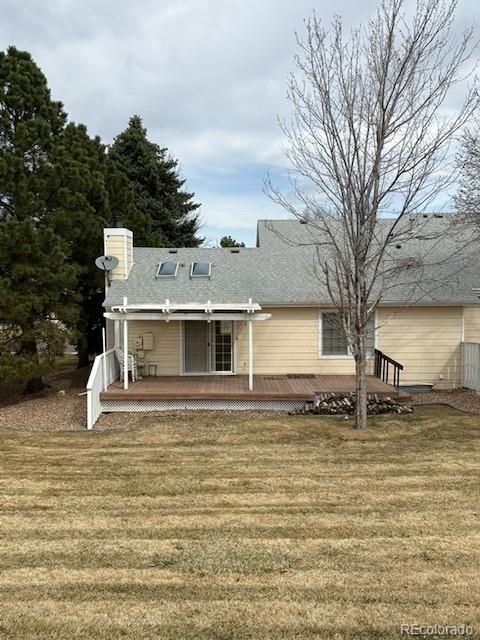 4 Shetland Court Highlands Ranch, CO 80130 - Photo 7 of 46 a white house that has a tree in front of it