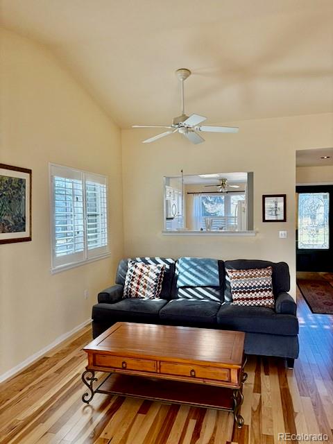 4 Shetland Court Highlands Ranch, CO 80130 - Photo 9 of 46 a living room with furniture and a wooden floor