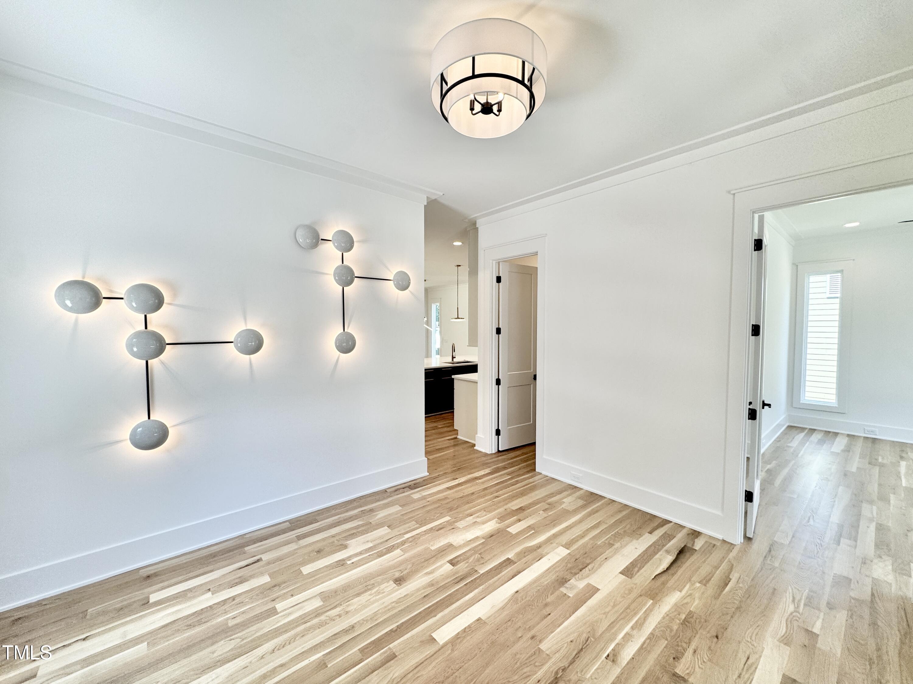 622 Glascock Street Raleigh, NC 27604 - Photo 14 of 81 a view of a livingroom with wooden floor and a ceiling fan