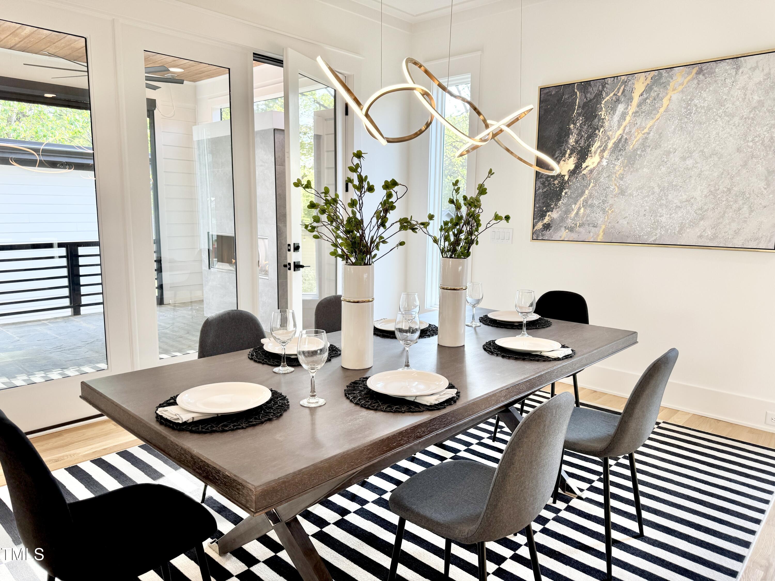 622 Glascock Street Raleigh, NC 27604 - Photo 18 of 81 a view of a dining room with furniture and wooden floor