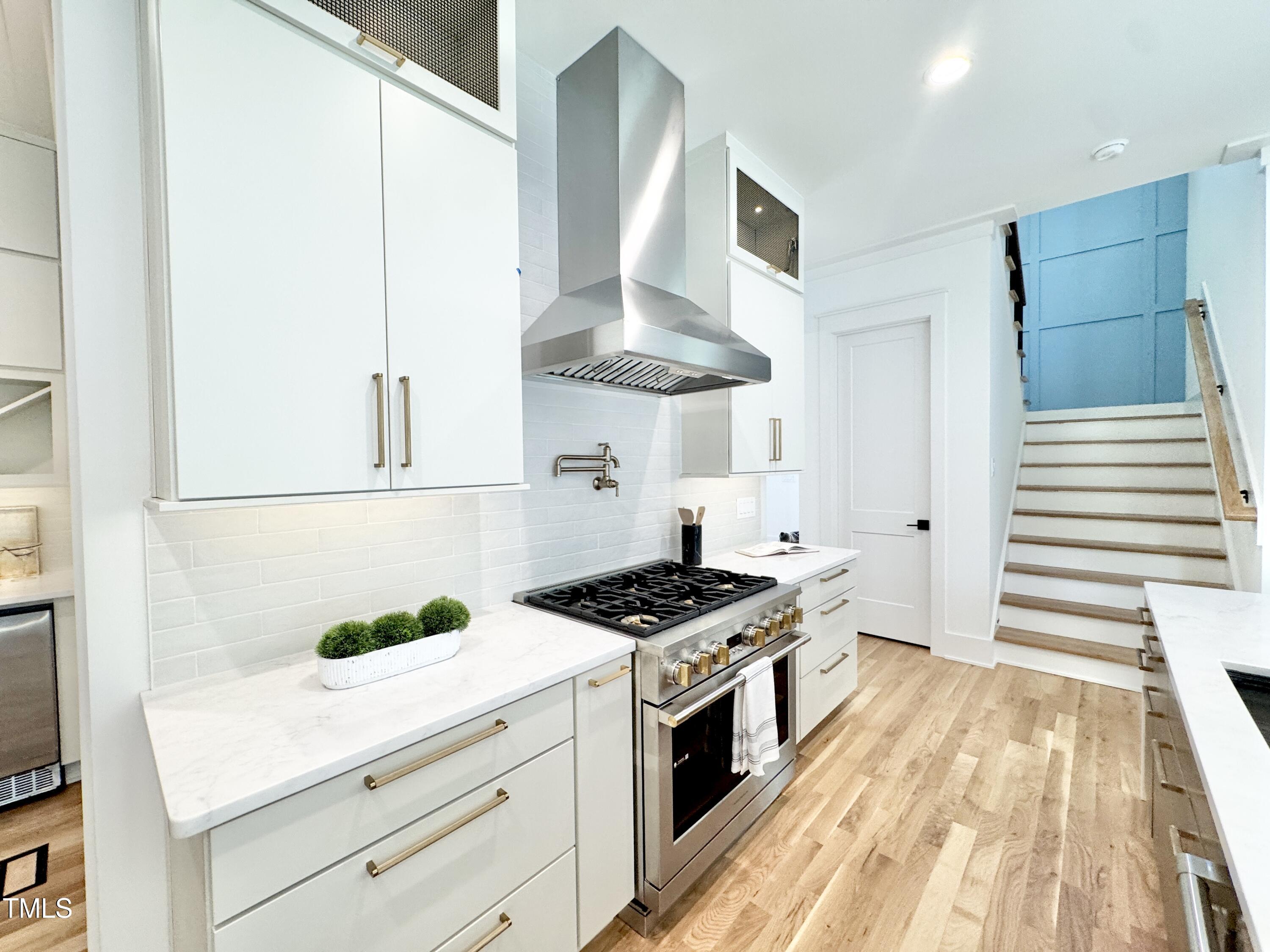 622 Glascock Street Raleigh, NC 27604 - Photo 23 of 81 a kitchen with stainless steel appliances a stove a sink and a refrigerator