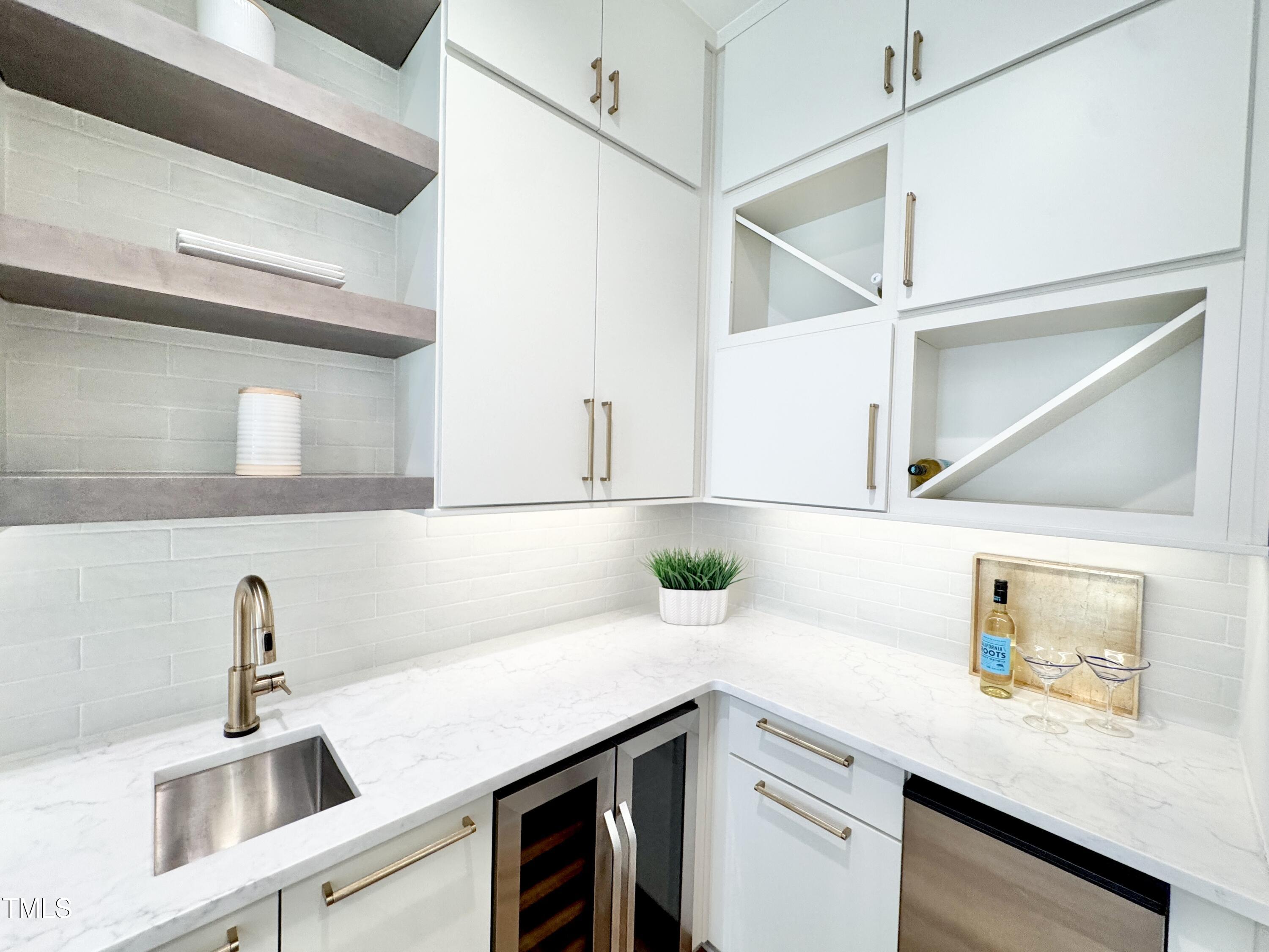 622 Glascock Street Raleigh, NC 27604 - Photo 25 of 81 a kitchen with a sink and cabinets