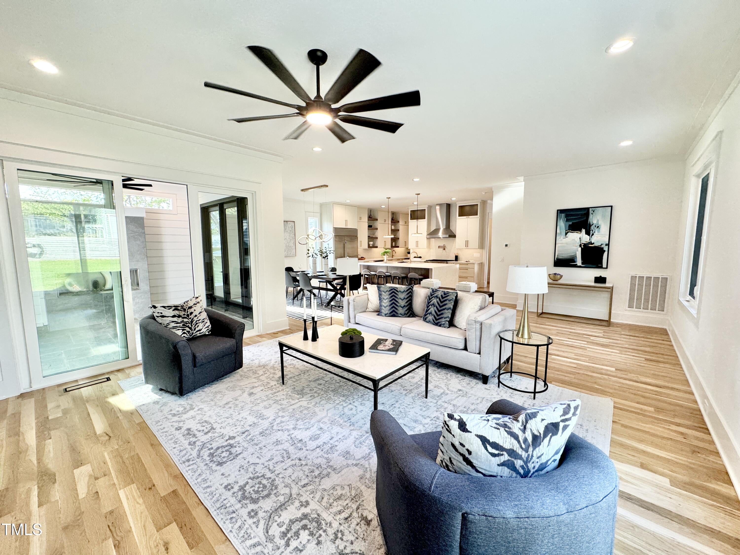 622 Glascock Street Raleigh, NC 27604 - Photo 30 of 81 a living room with furniture and a wooden floor