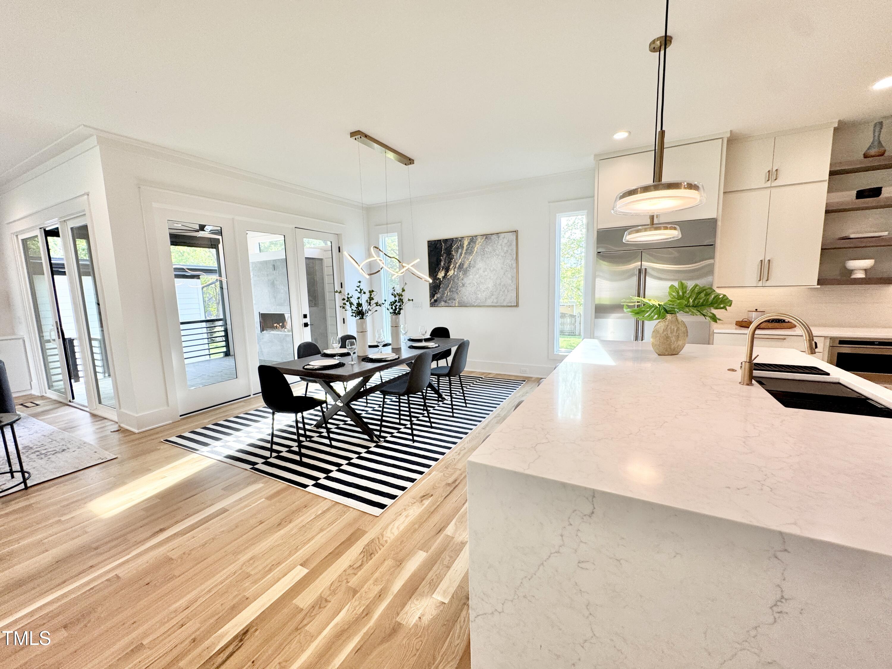 622 Glascock Street Raleigh, NC 27604 - Photo 38 of 81 a living room with furniture a window and a dining table