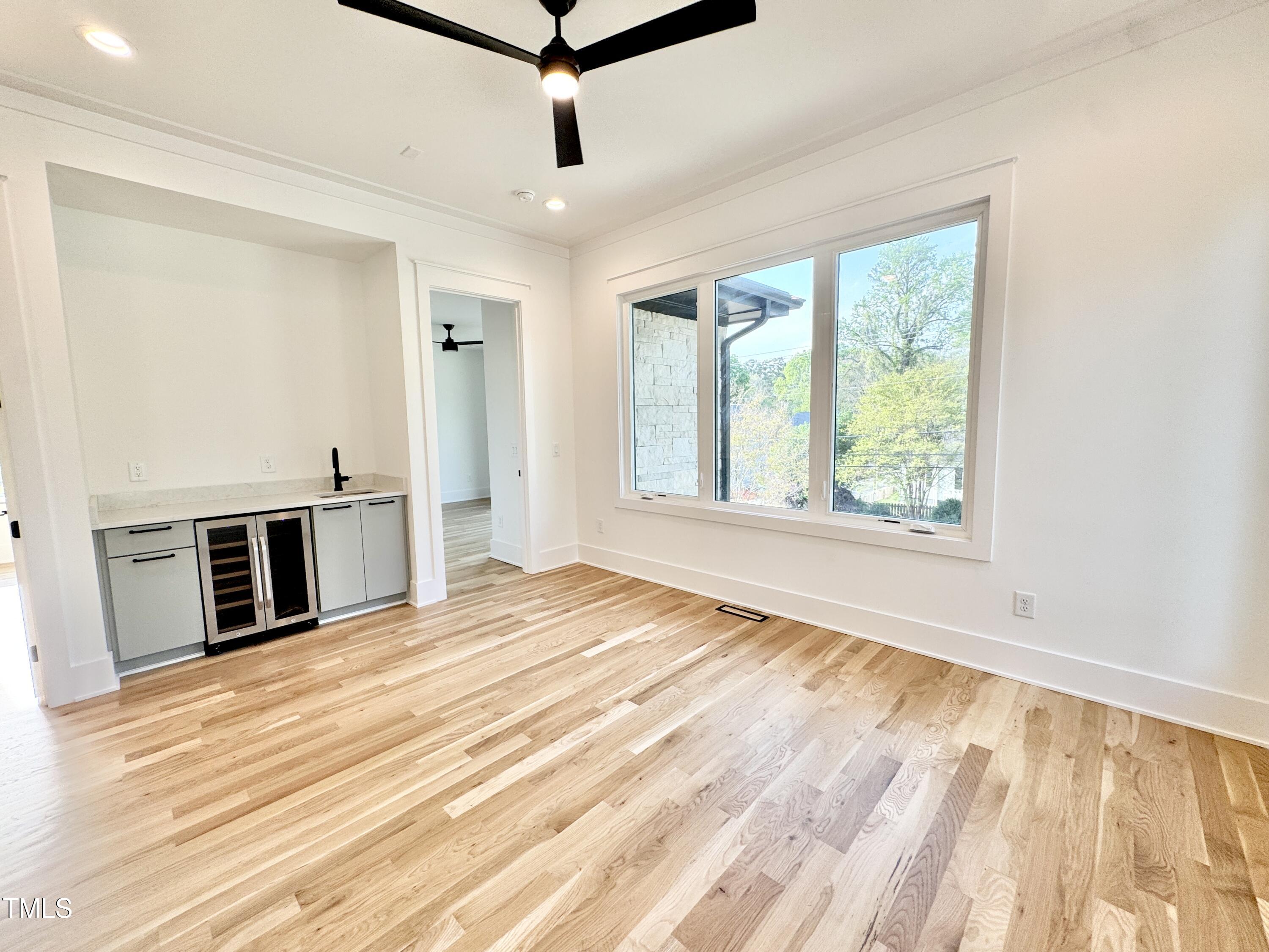 622 Glascock Street Raleigh, NC 27604 - Photo 45 of 81 a view of a kitchen with an empty room and wooden floor