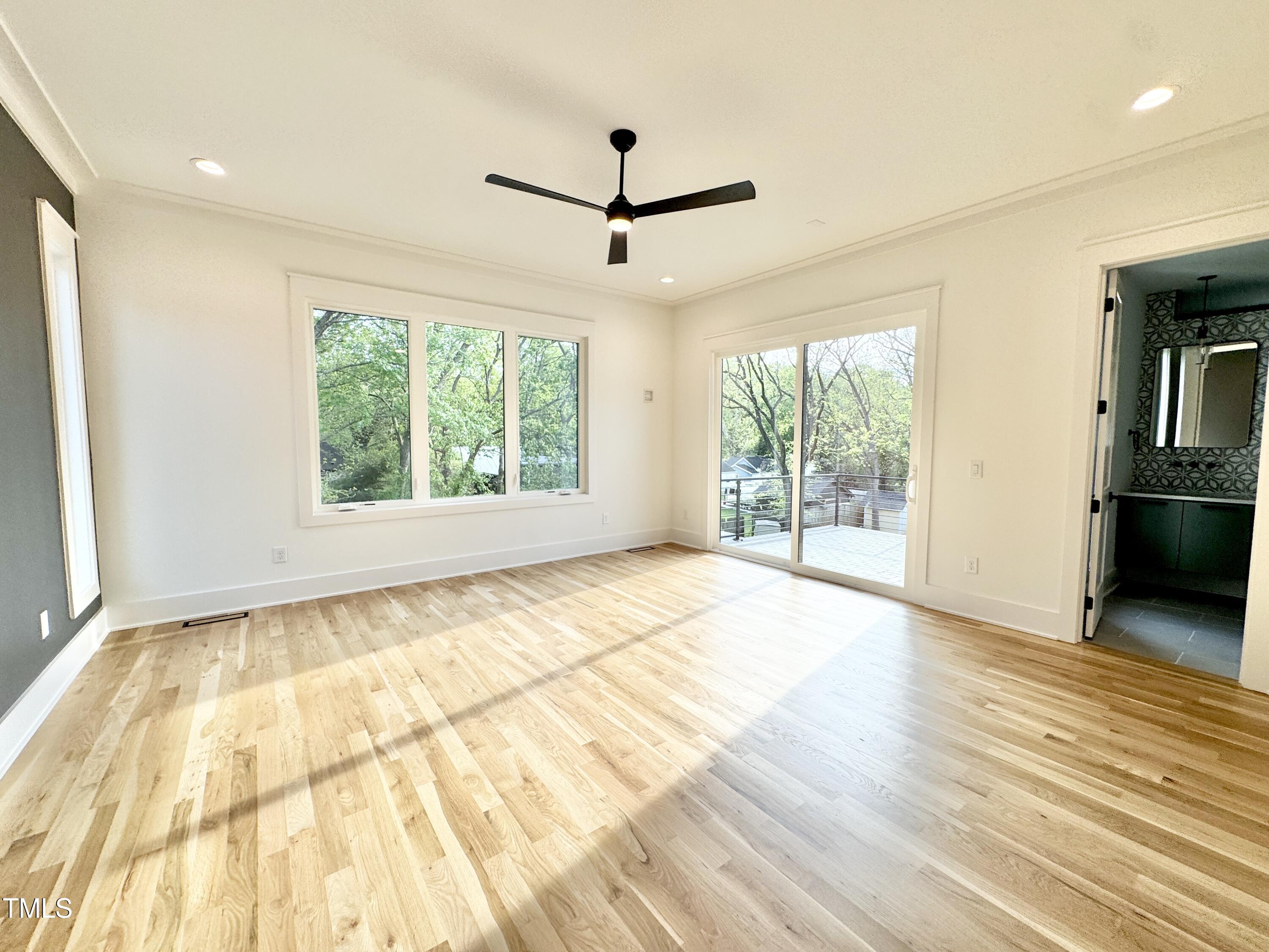 622 Glascock Street Raleigh, NC 27604 - Photo 50 of 81 a view of an empty room with wooden floor and a window