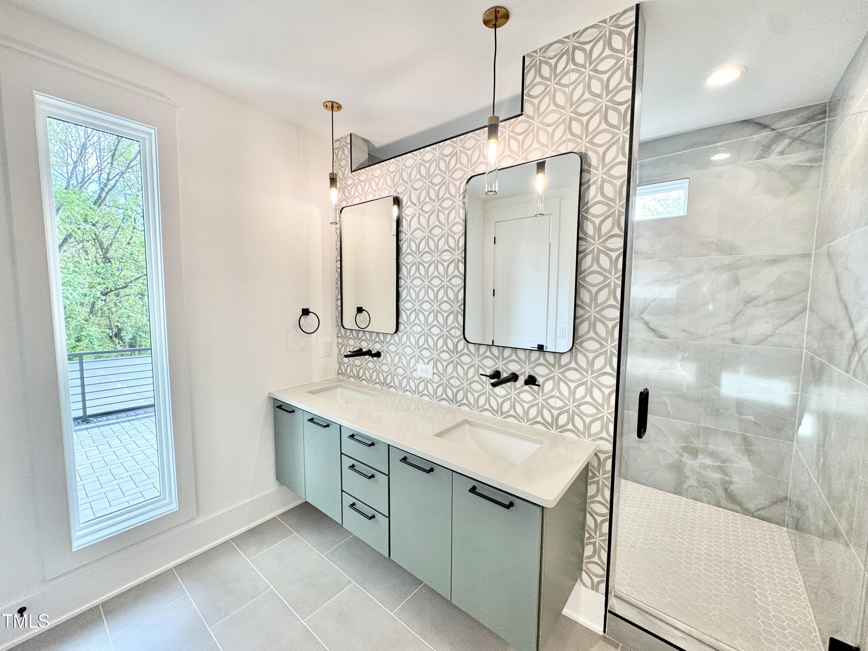 622 Glascock Street Raleigh, NC 27604 - Photo 52 of 81 a bathroom with a double vanity sink mirror and shower