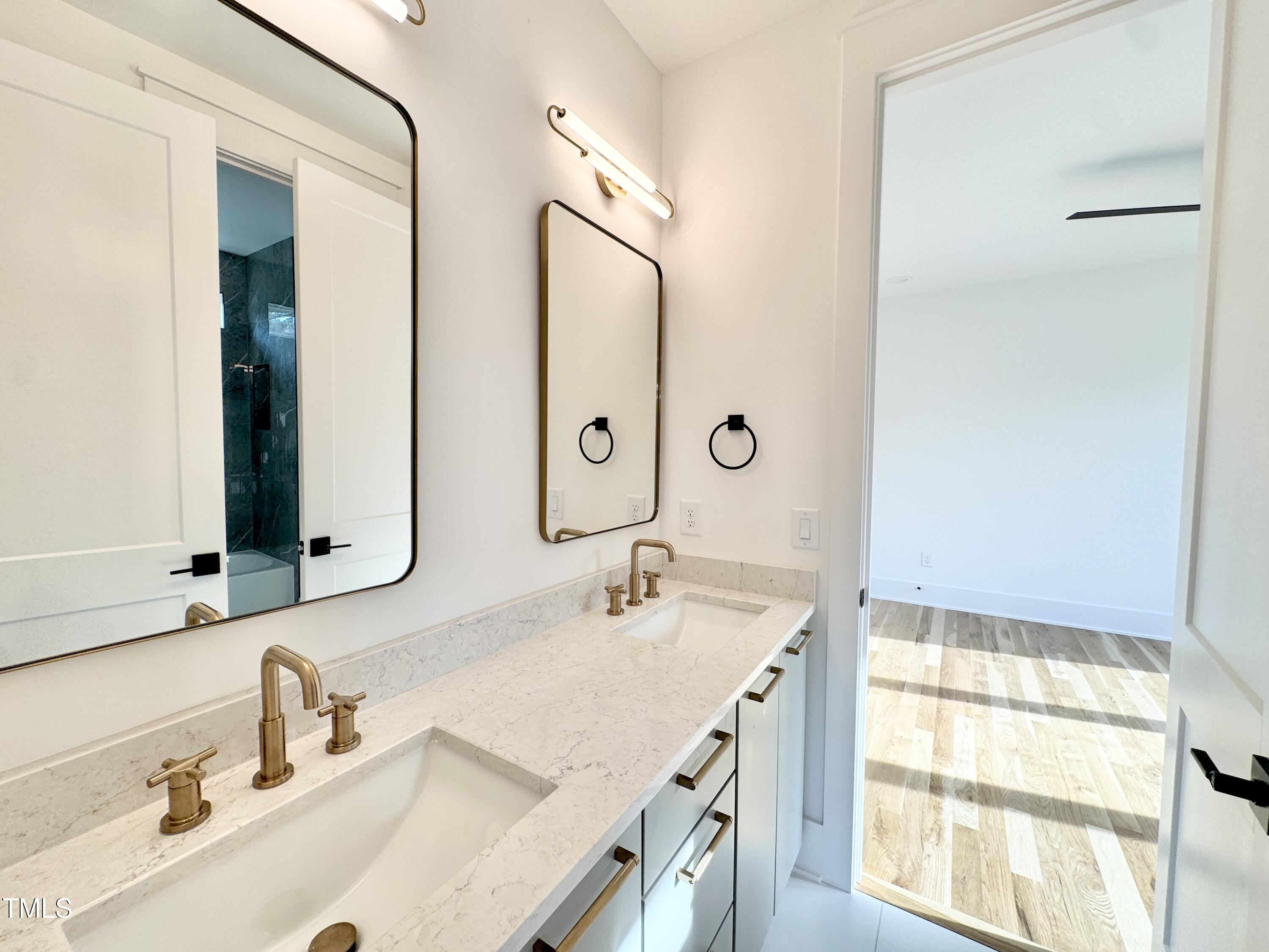 622 Glascock Street Raleigh, NC 27604 - Photo 60 of 81 a bathroom with a double vanity sink mirror and