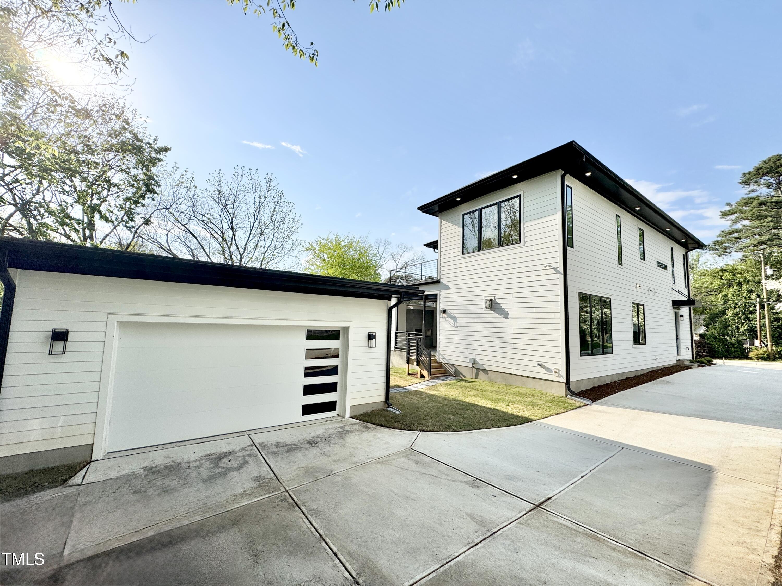 622 Glascock Street Raleigh, NC 27604 - Photo 75 of 81 a view of a house with a yard and garage