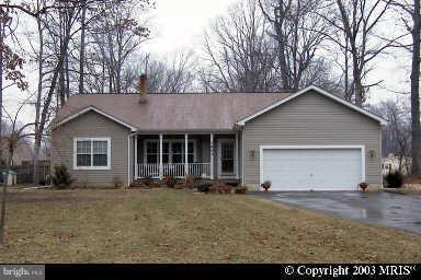 1901 Mitchellville Road Bowie, MD 20716 - Photo 1 of 20 a front view of a house with a yard and garage
