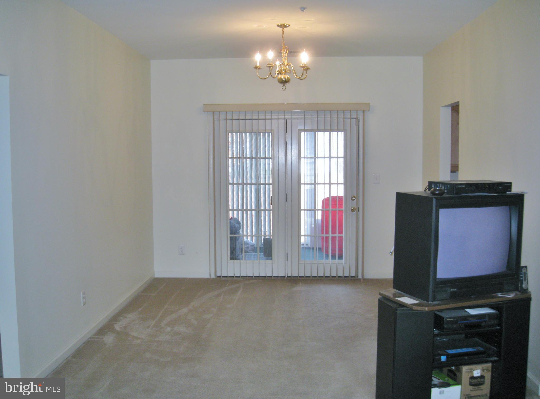 1901 Mitchellville Road Bowie, MD 20716 - Photo 11 of 20 a view of an empty room with a fireplace
