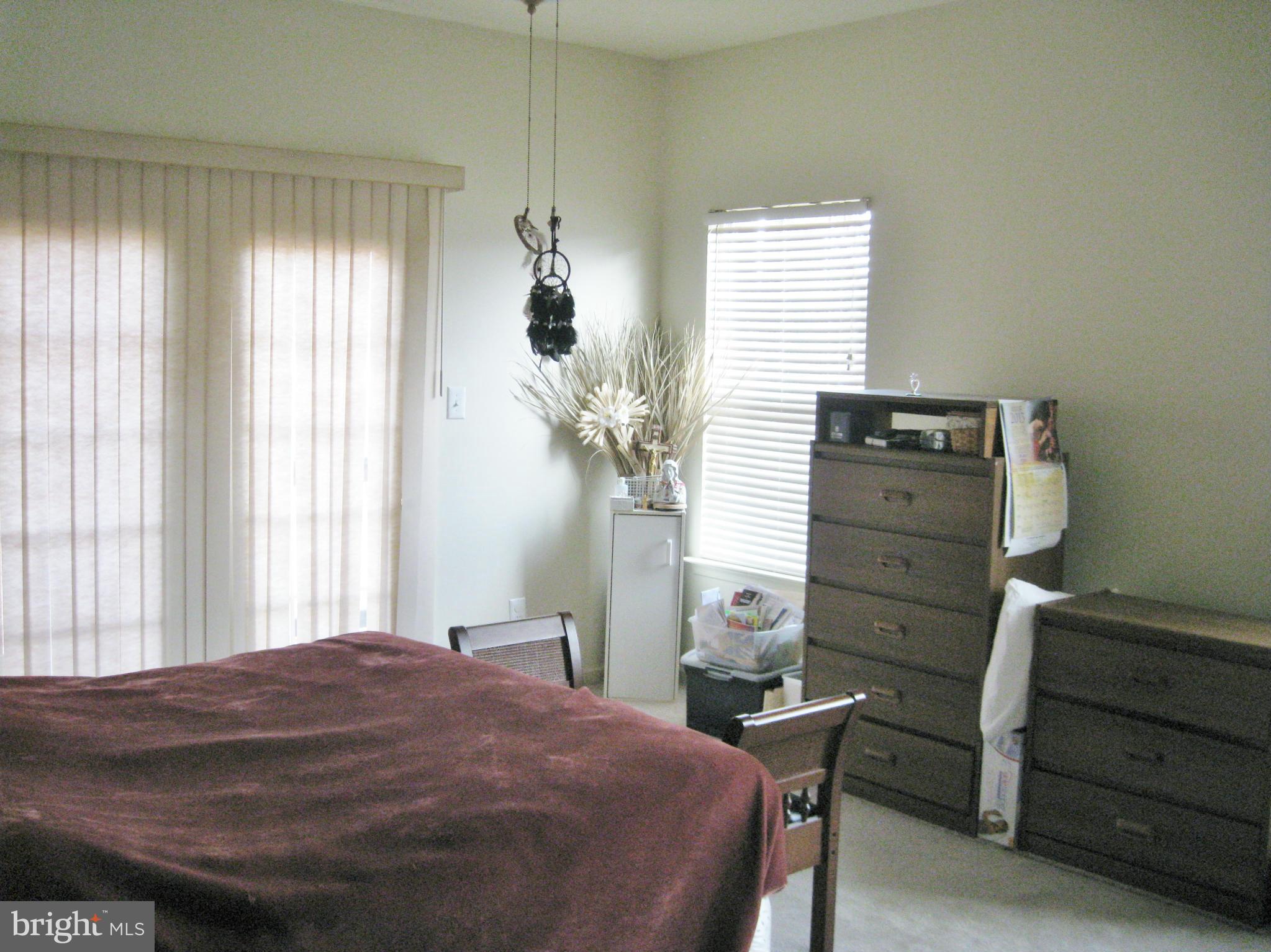 1901 Mitchellville Road Bowie, MD 20716 - Photo 14 of 20 a bedroom with a bed and a window