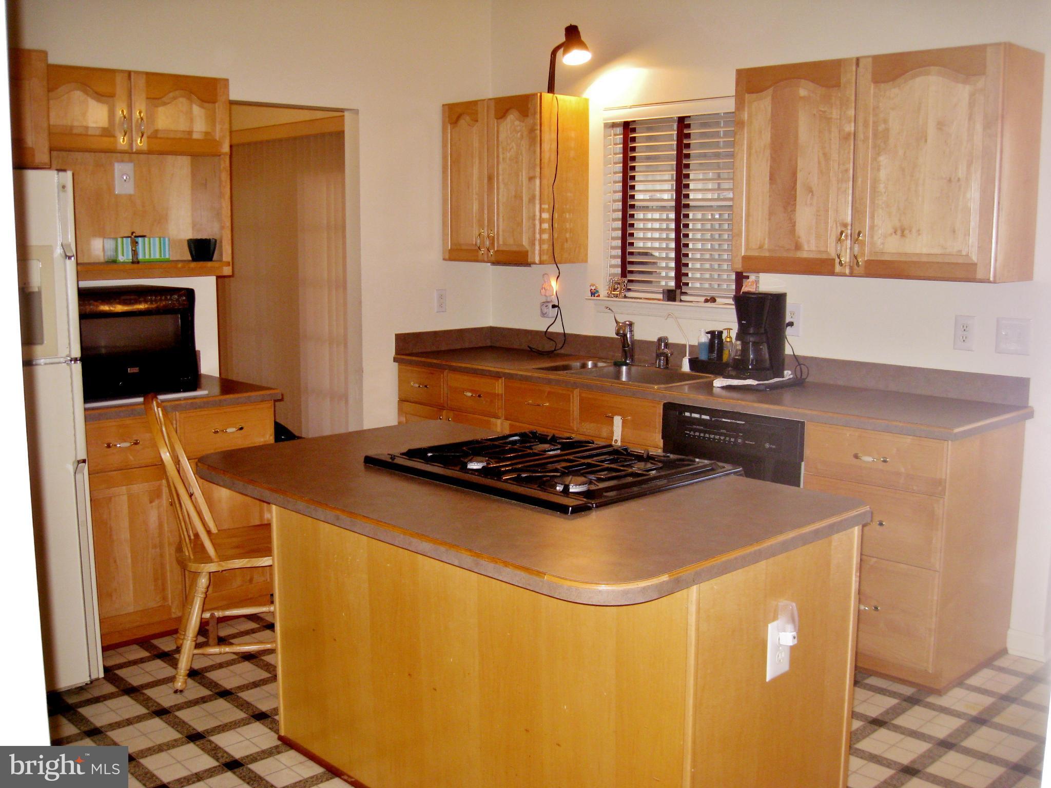 1901 Mitchellville Road Bowie, MD 20716 - Photo 5 of 20 a kitchen with a stove and a sink