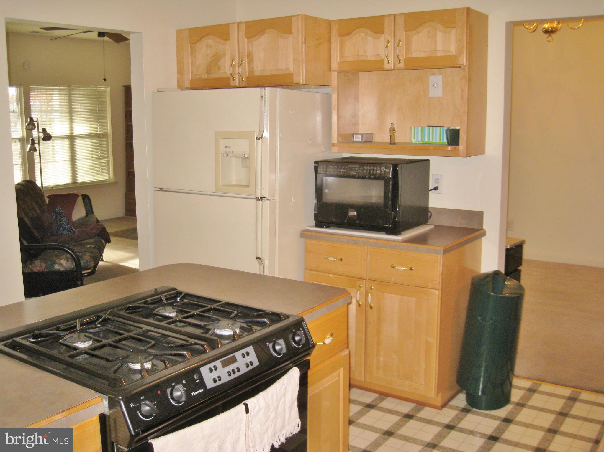 1901 Mitchellville Road Bowie, MD 20716 - Photo 6 of 20 a stove top oven sitting inside of a kitchen