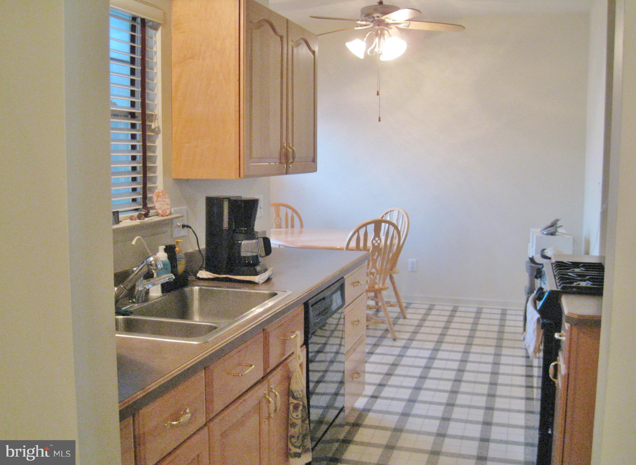 1901 Mitchellville Road Bowie, MD 20716 - Photo 7 of 20 a kitchen with a sink cabinets and window