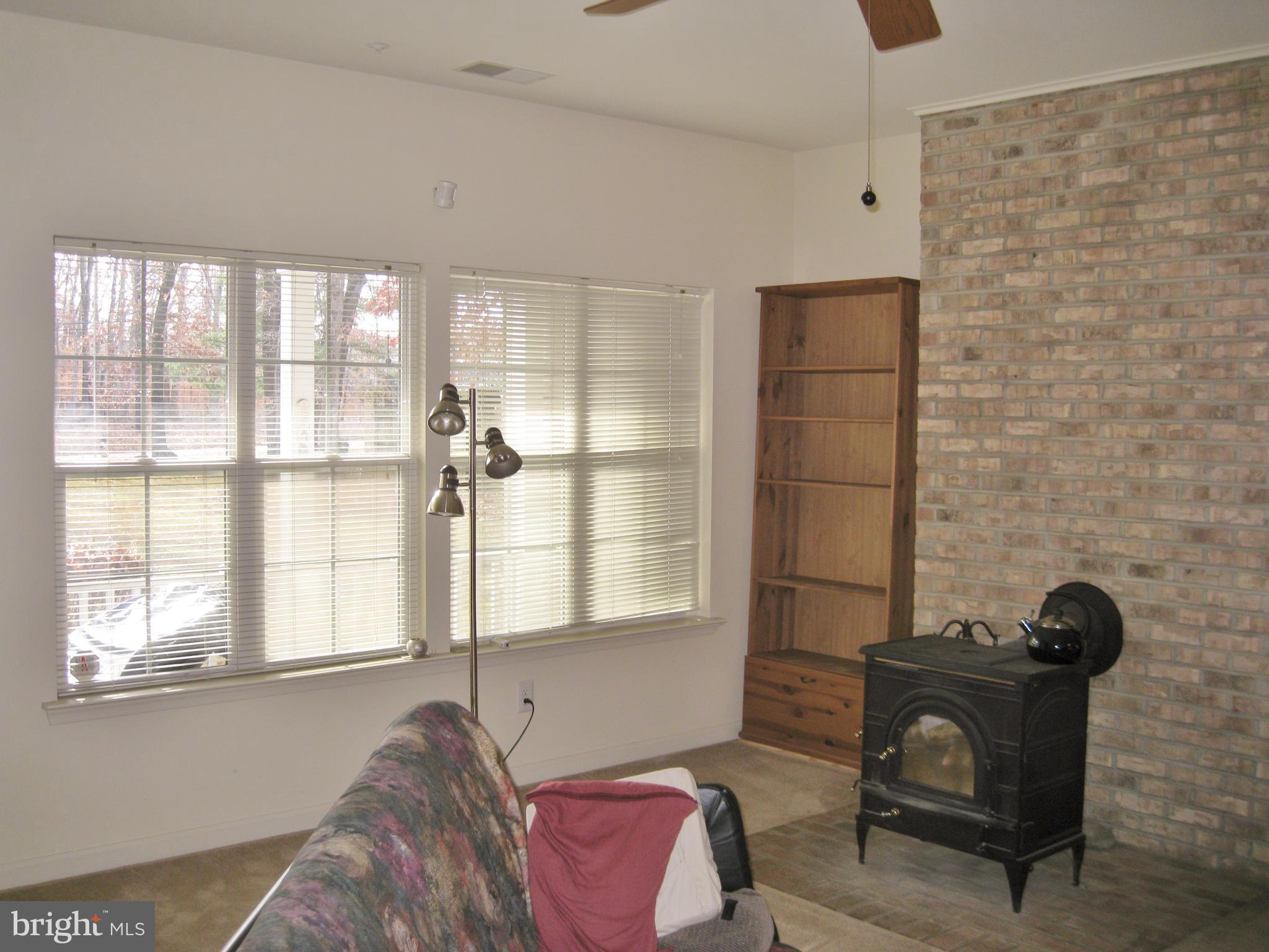 1901 Mitchellville Road Bowie, MD 20716 - Photo 9 of 20 a bedroom with a bed and a window
