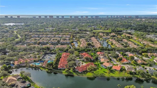 an aerial view of residential house with outdoor space and lake view