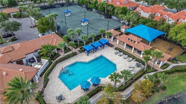 an aerial view of a house a garden and swimming pool