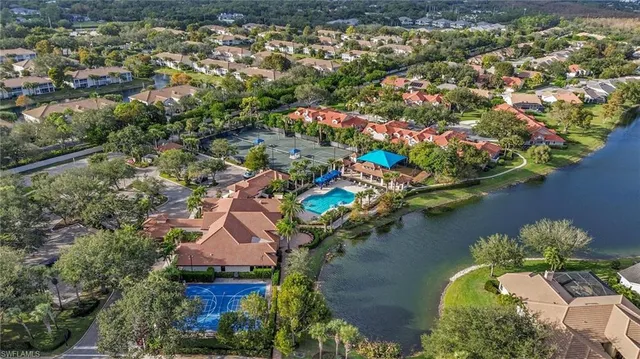 an aerial view of a house with a lake view