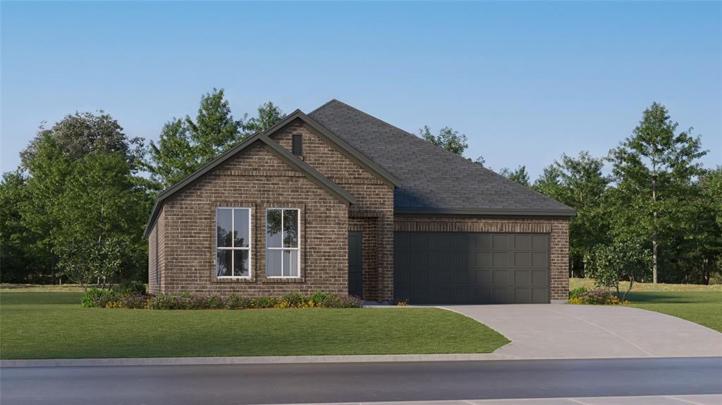 View of front of property featuring a garage and a front lawn
