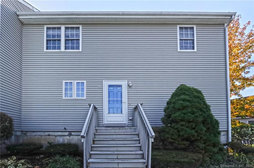 a view of a house with a street