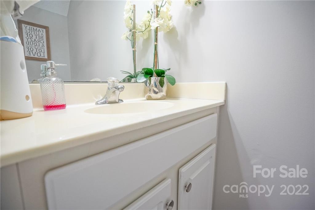 839 Matthews School Road Matthews, NC 28105 - Photo 13 of 37 a bathroom with a sink and a mirror
