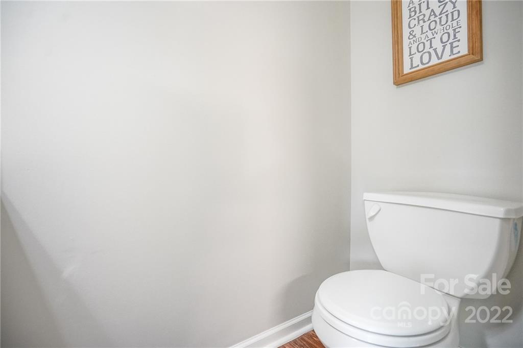 839 Matthews School Road Matthews, NC 28105 - Photo 14 of 37 a white toilet sitting next to a white wall