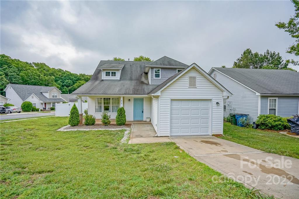 839 Matthews School Road Matthews, NC 28105 - Photo 2 of 37 a front view of a house with a yard