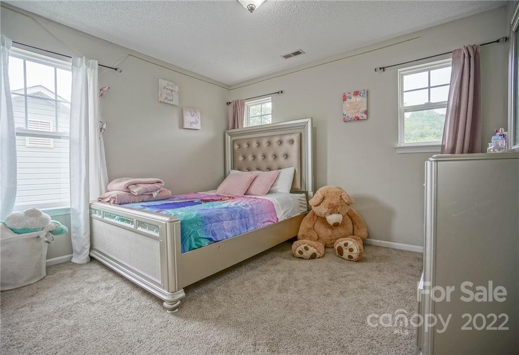 839 Matthews School Road Matthews, NC 28105 - Photo 22 of 37 a bedroom with a bed and window