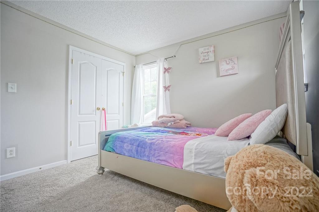 839 Matthews School Road Matthews, NC 28105 - Photo 23 of 37 a bedroom with a bed and a window