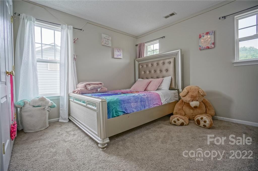 839 Matthews School Road Matthews, NC 28105 - Photo 25 of 37 a bedroom with a bed and a window