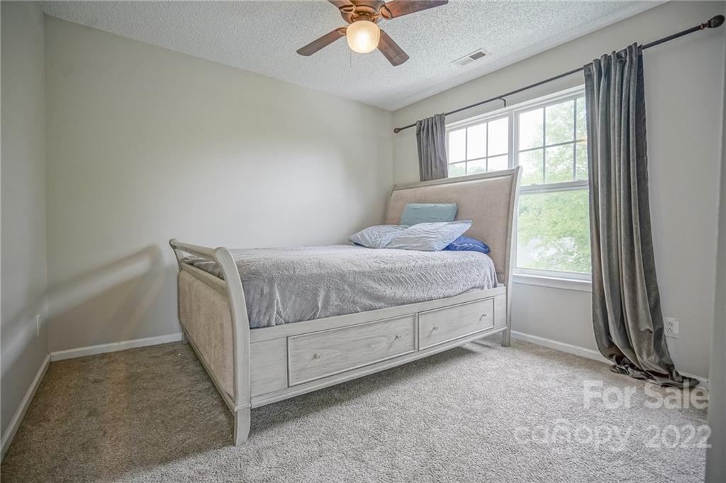 839 Matthews School Road Matthews, NC 28105 - Photo 26 of 37 a bed room with a bed and a window