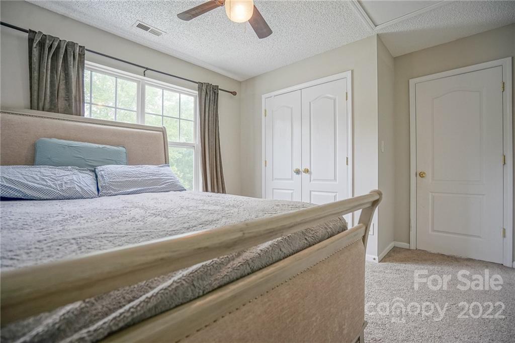 839 Matthews School Road Matthews, NC 28105 - Photo 28 of 37 a bedroom with a bed and a window