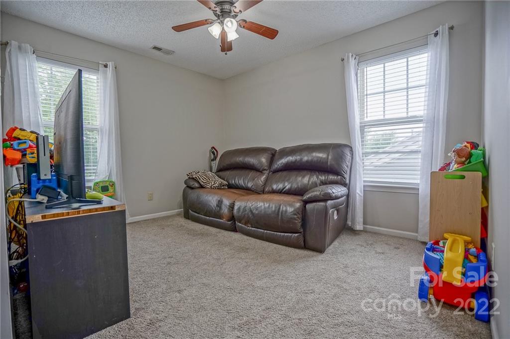 839 Matthews School Road Matthews, NC 28105 - Photo 29 of 37 a living room with furniture and a window