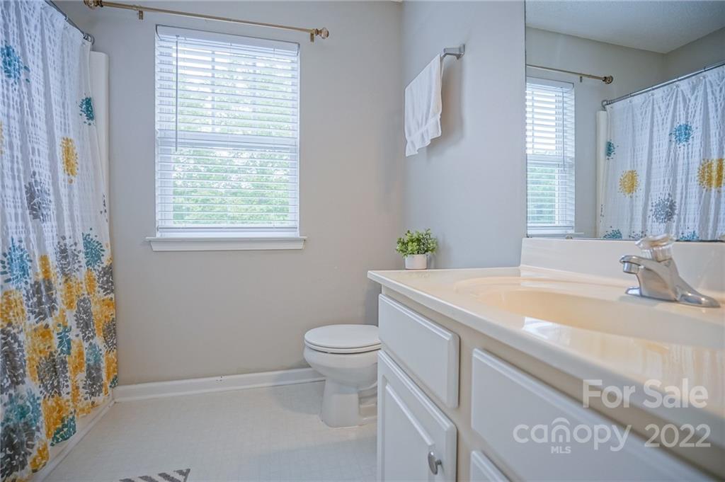 839 Matthews School Road Matthews, NC 28105 - Photo 32 of 37 a bathroom with a sink toilet and window
