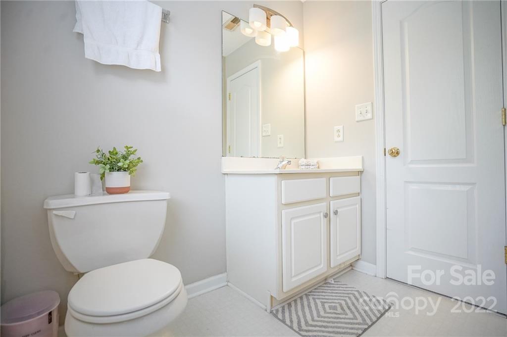 839 Matthews School Road Matthews, NC 28105 - Photo 33 of 37 a bathroom with a toilet a sink and mirror