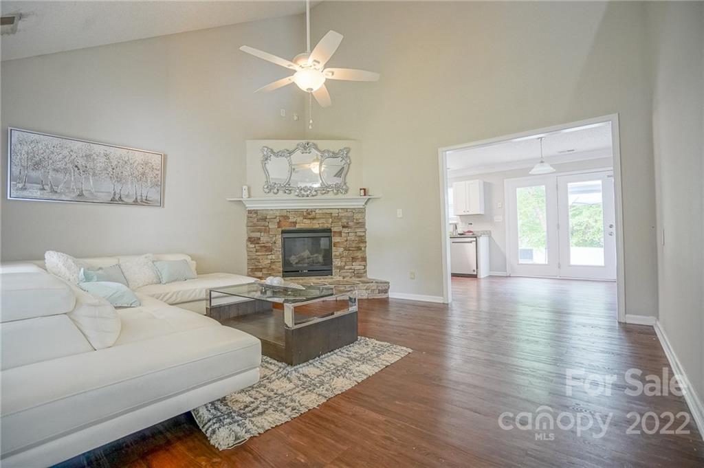 839 Matthews School Road Matthews, NC 28105 - Photo 7 of 37 a living room with furniture and a fireplace