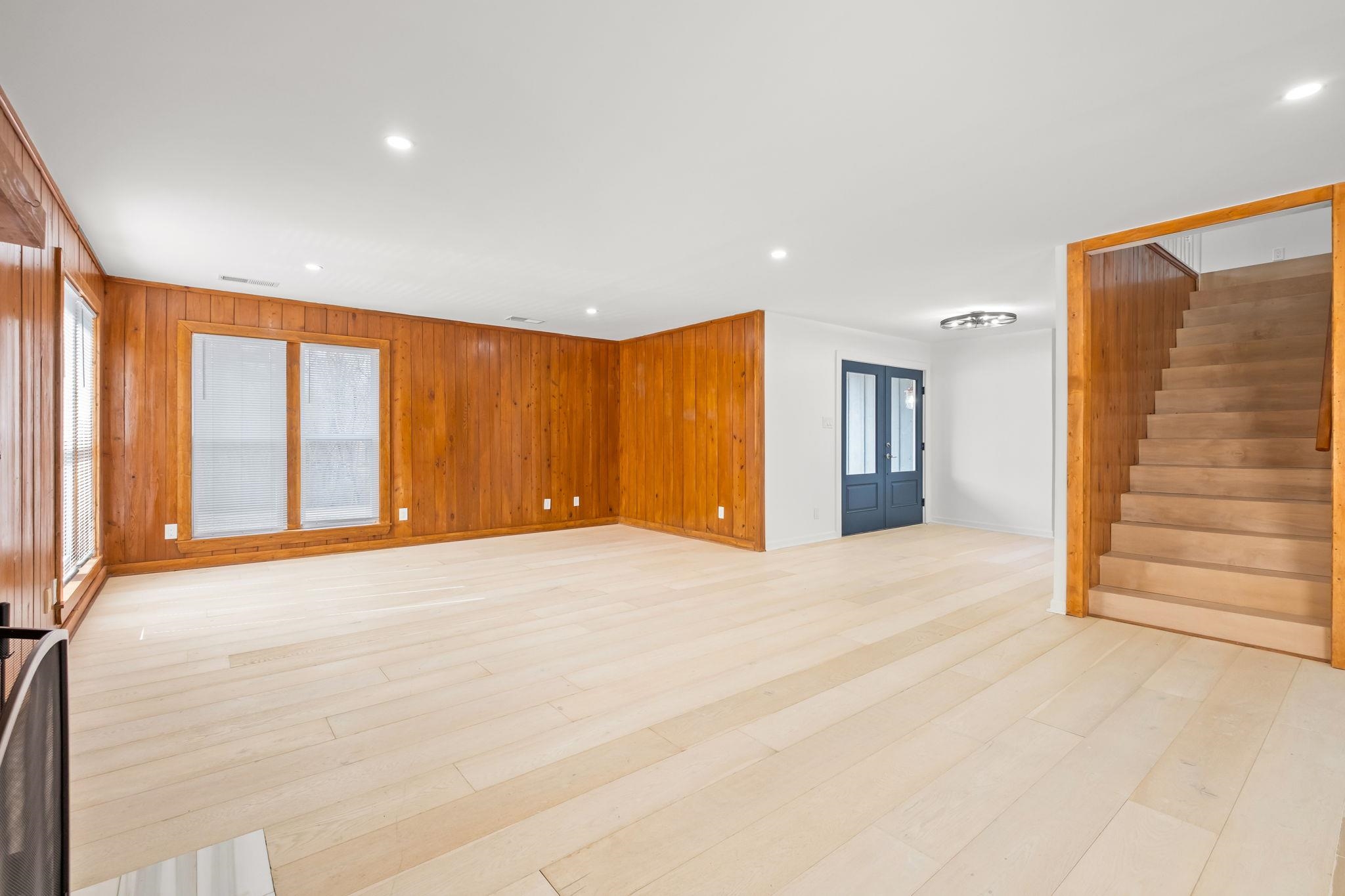 6224 Benjestown Road Memphis, TN 38127 - Photo 8 of 39 Unfurnished living room featuring recessed lighting, wood walls, and light wood-style floors