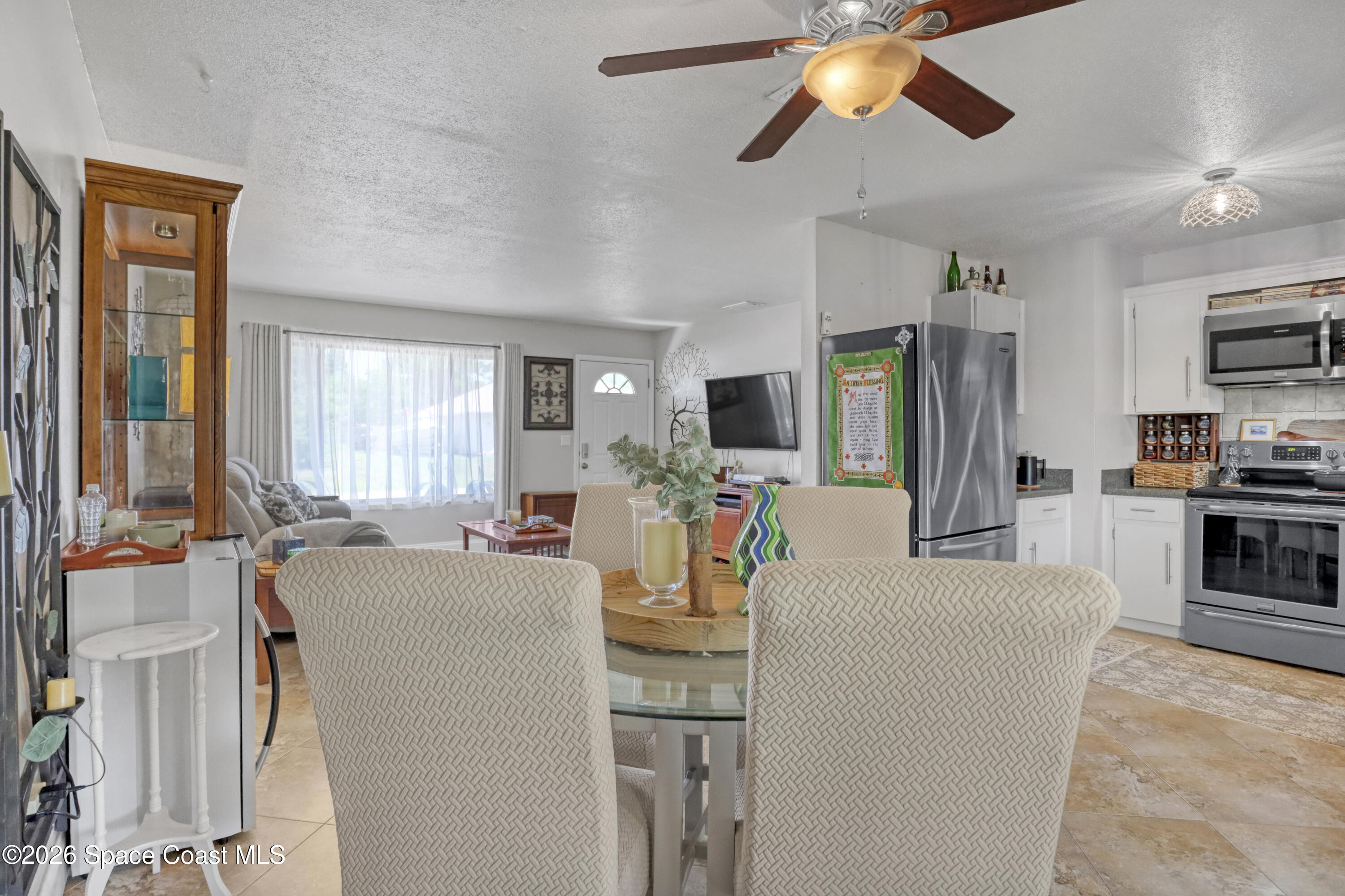 858 Carnival Road Southeast Palm Bay, FL 32909 - Photo 7 of 21 Dining Area To Living Room