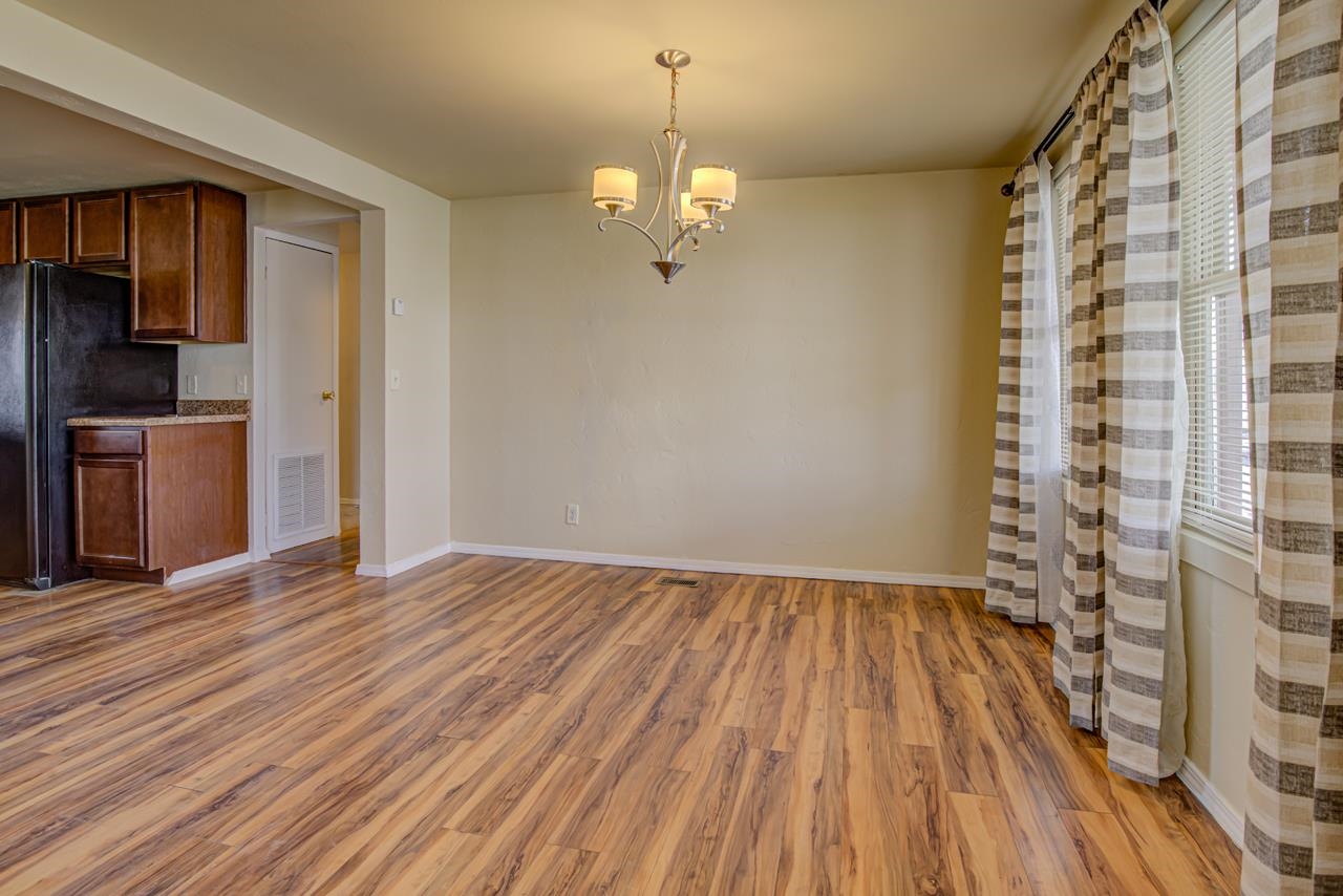 227 29 Road Grand Junction, CO 81503 - Photo 3 of 20 a view of empty room with wooden floor and fan