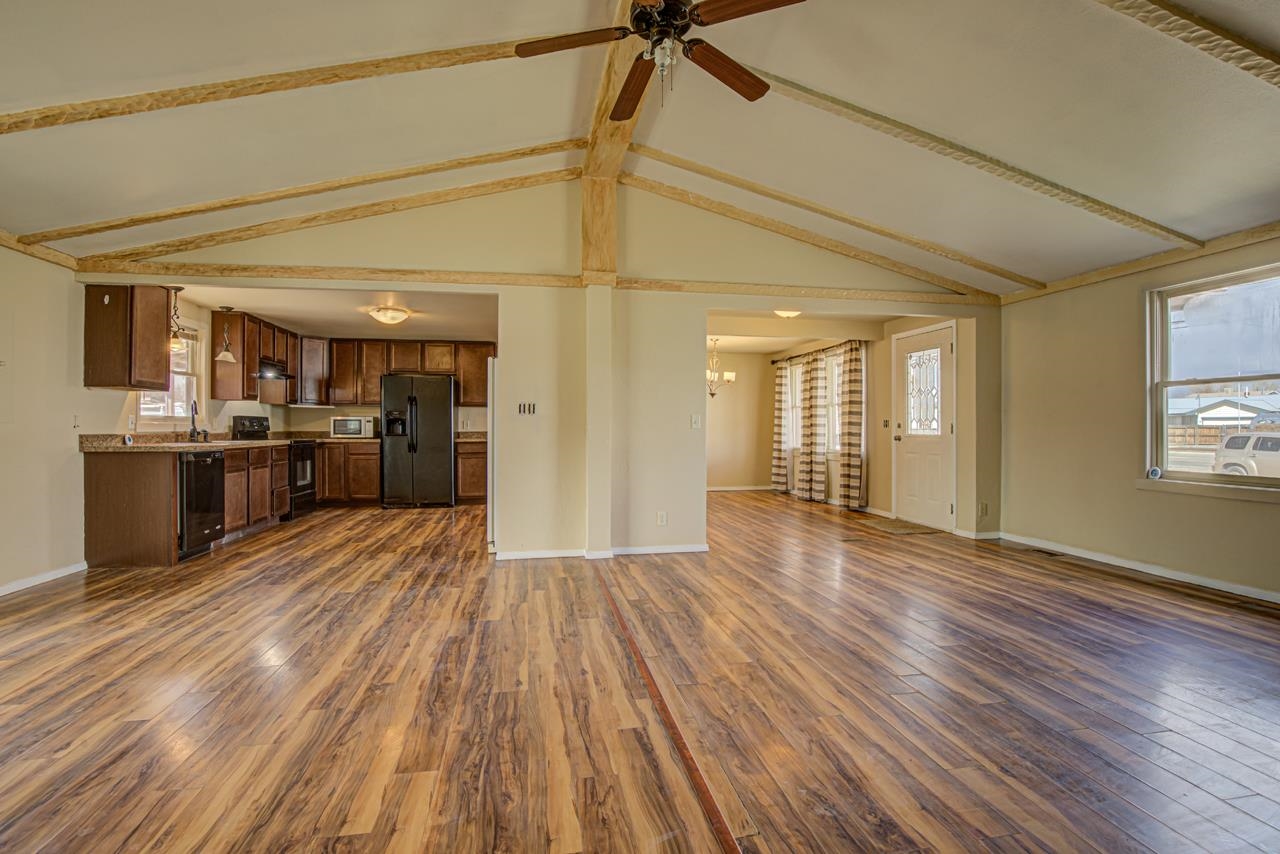 227 29 Road Grand Junction, CO 81503 - Photo 7 of 20 a view of a kitchen with wooden floor and a kitchen