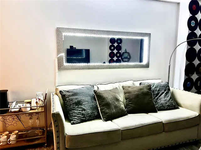 a white toilet sitting next to a shower curtain